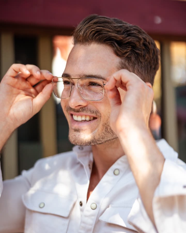 Andreas Schmid, eyewear campaign, smiling in clear glasses