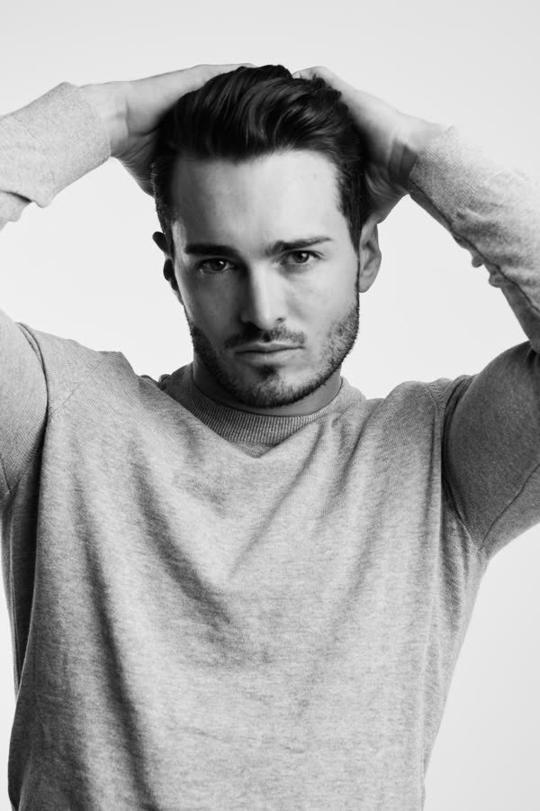Andreas Schmid, black and white studio photo, hands in his hair